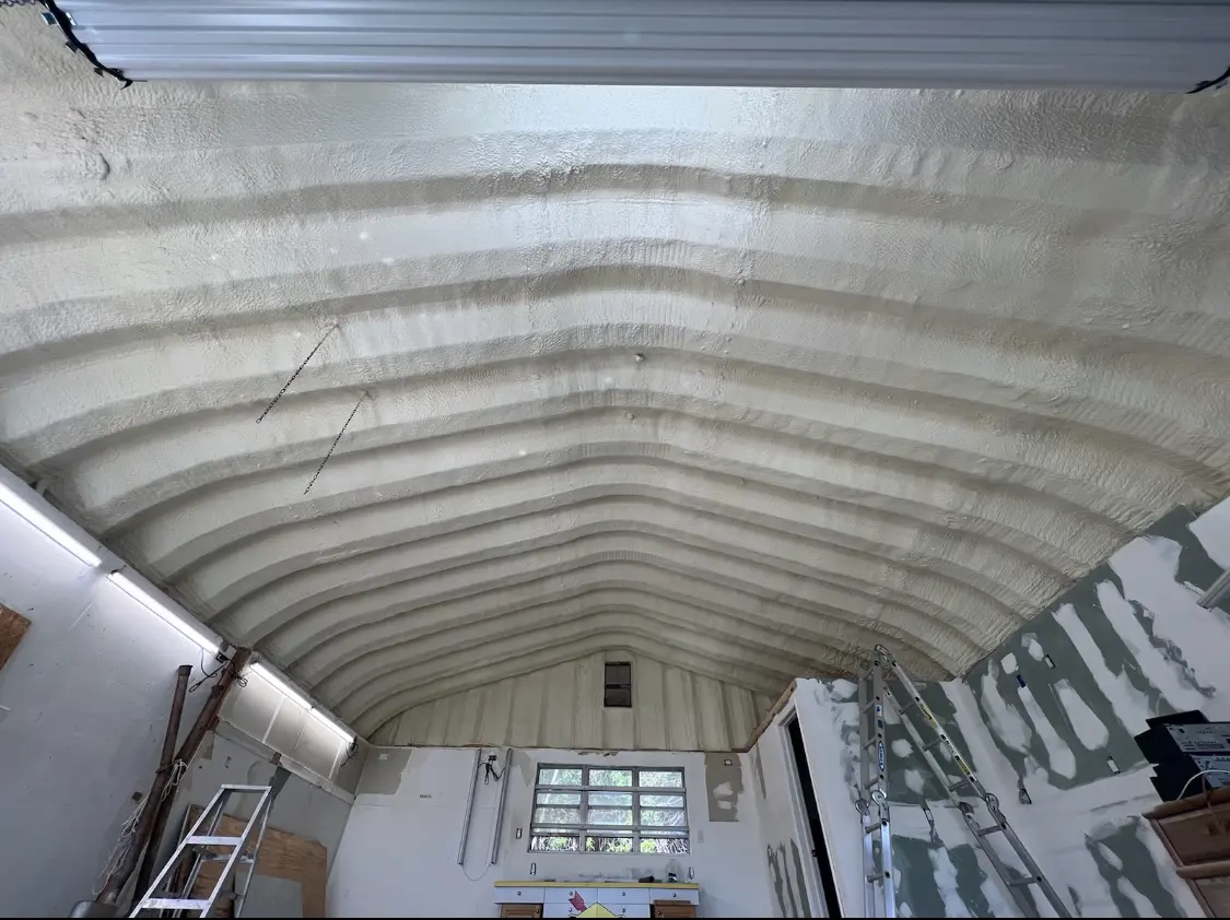 Spray polyurethane foam applied to the underside of a metal roof deck in Keokuk